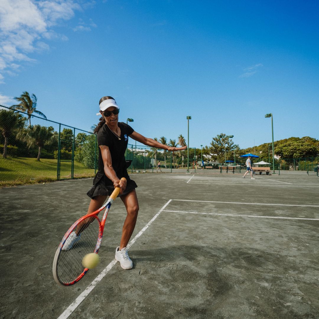 Tennis Pro practicing on the court